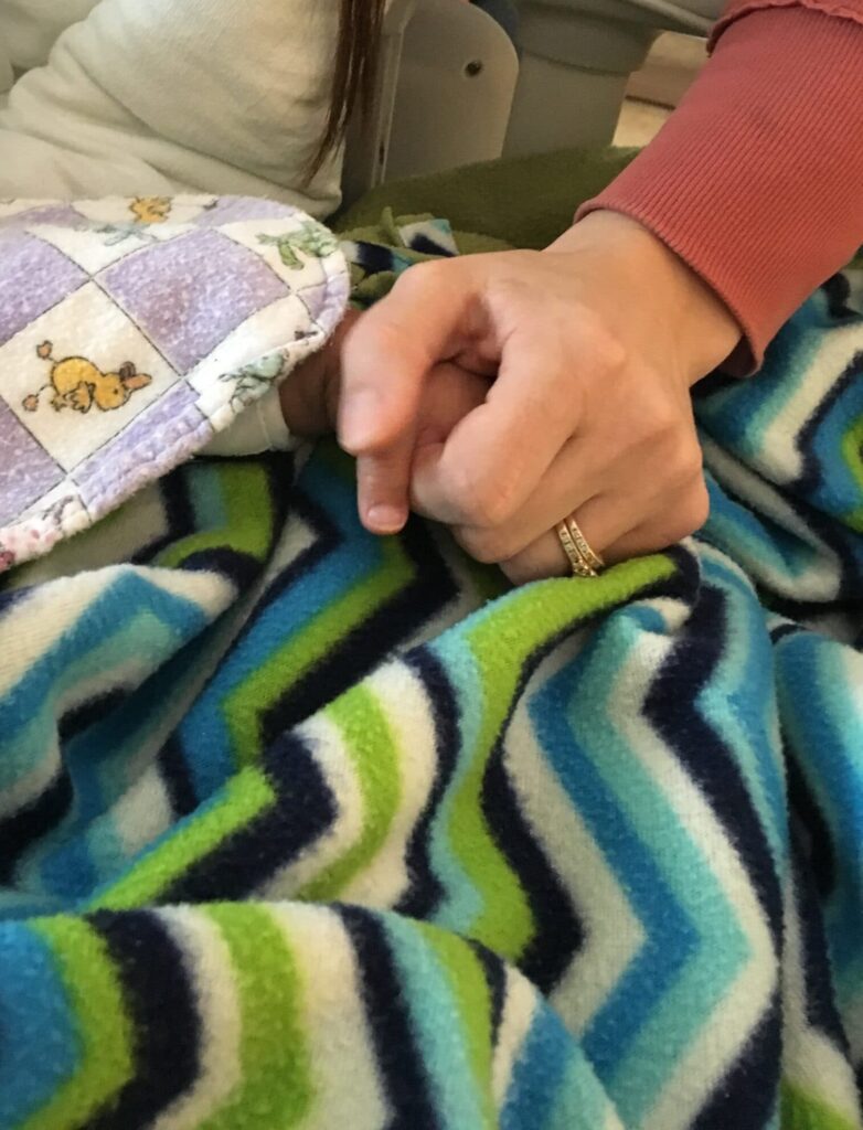 Holding my baby's hand after heart surgery, reminding ourselves that faithful is our God
