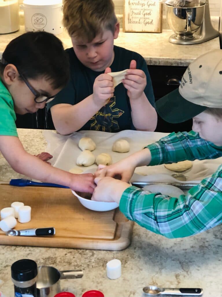 children making Resurrection rolls together