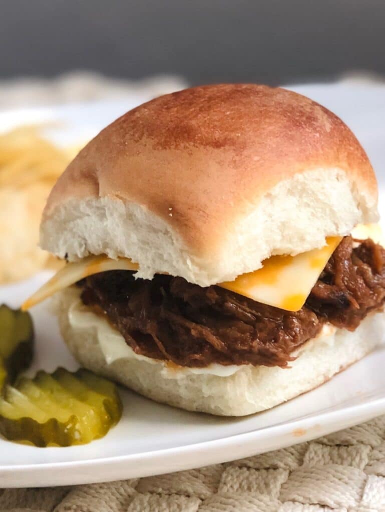 Pulled BBQ Beef piled on a bun