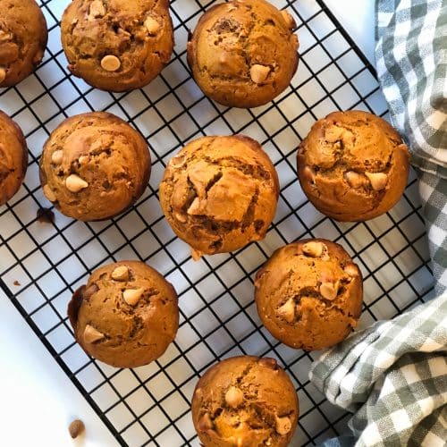Delicious Pumpkin Butterscotch Muffins lined up on a cooling rack.