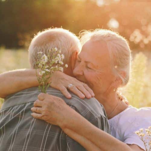 An elderly couple embracing reminds us of how to nurture your marriage through forgiveness.