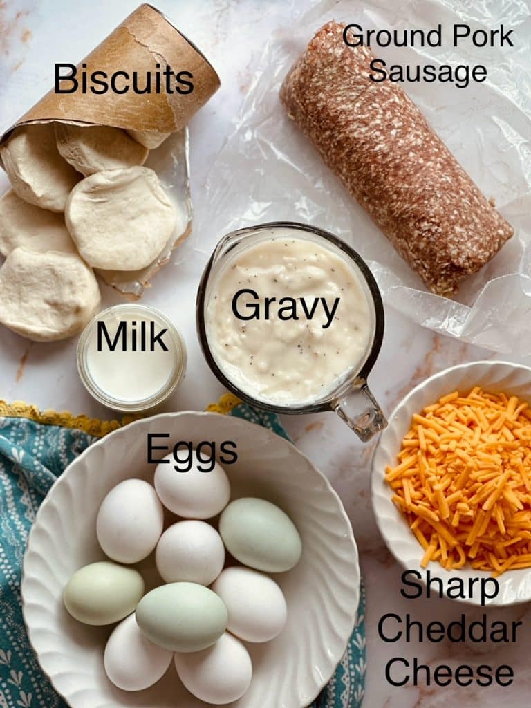an overhead view of the ingredients needed to make Biscuit and Gravy Breakfast Casserole