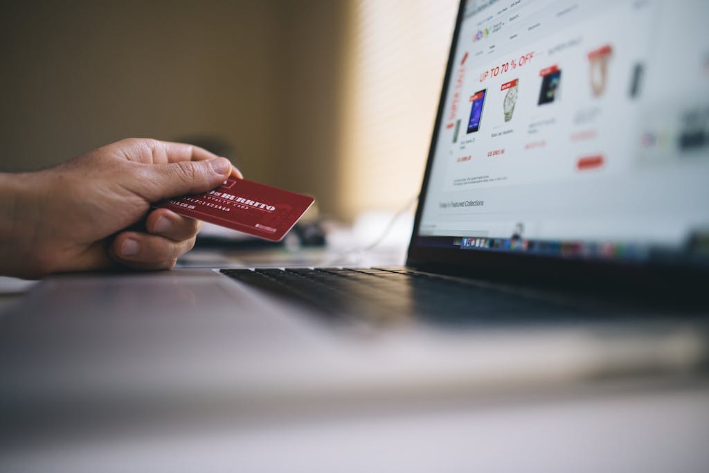 A person shopping online with a credit card reminds us that online shopping makes it extremely easy to not practice wise financial stewardship.