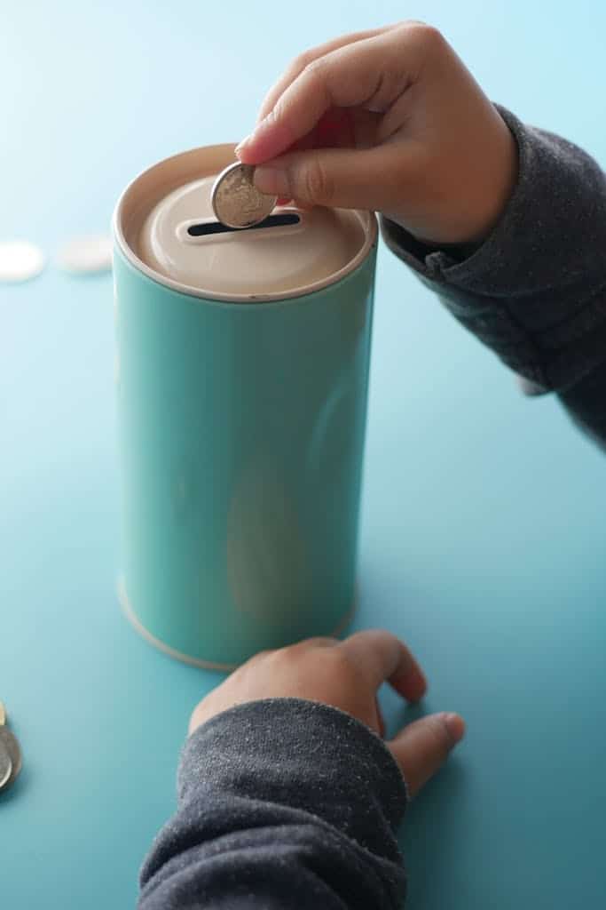 Close-up of Putting a Coin on a Can