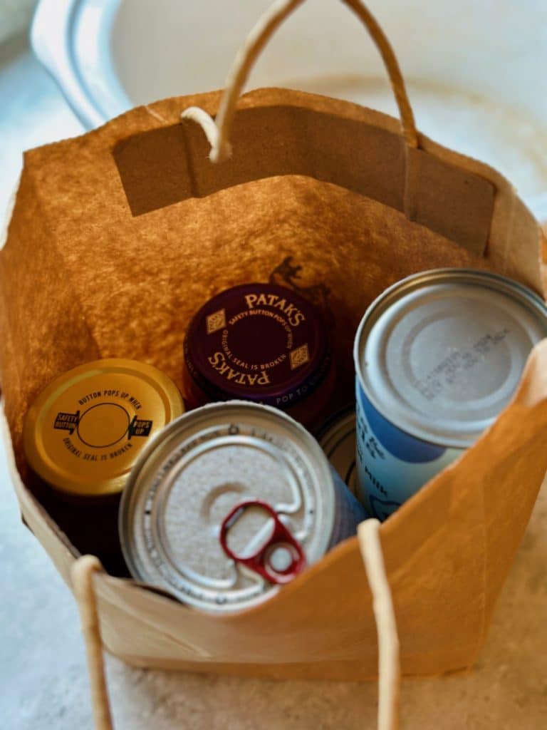 A bag containing all the shelf-stable ingredients for slow-cooker butter chicken.
